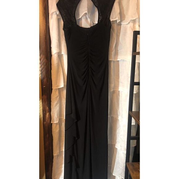 Turn heads with this R & M Richards black cap sleeve beaded gown.Retail $149.00 - Picture 16 of 16